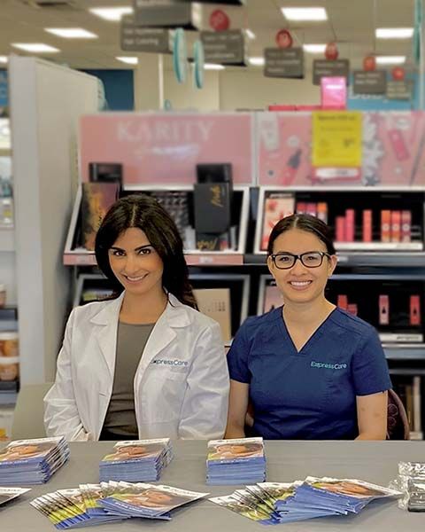 journal-new-medical-director-Marina-Sarwary-shares-card-2.jpg	Medical Director Marina Sarwary, sits at a booth next to Medical Assistant Citlali Lara Marquez, both are Hispanic women.