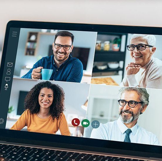 Four multiethnic professionals on a video call during a virtual interview.