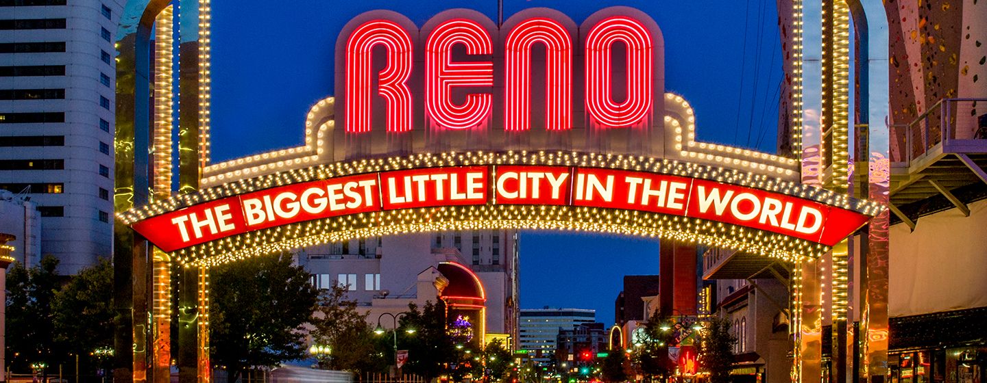 The famous Reno, Nevada sign in neon lights that says "Reno, the biggest little city in the world."