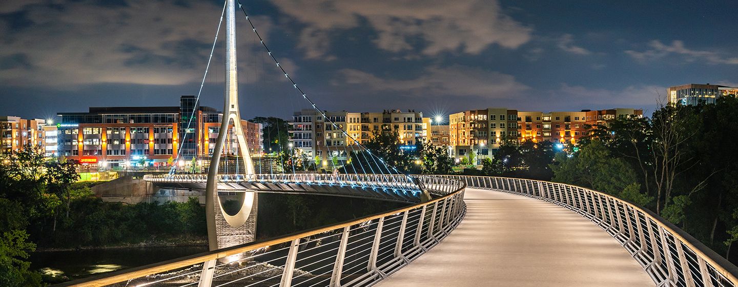 Pedestrian Bridge at night with lights all around in Ohio.